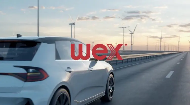 A sleek white car driving on a highway with wind turbines in the background, featuring the WEX logo prominently displayed.