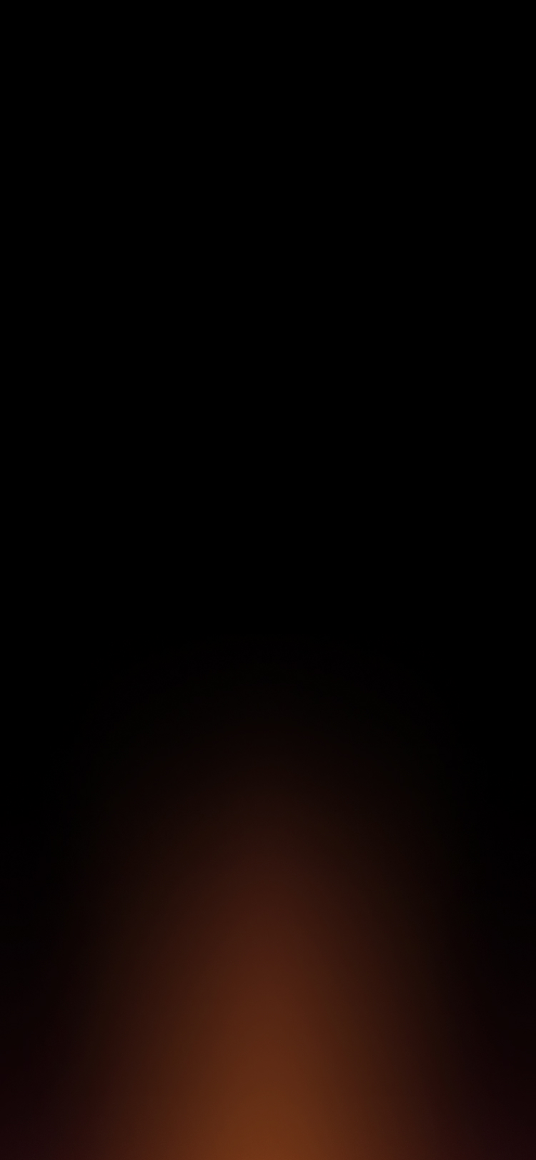 Abstract gradient background featuring a smooth transition from dark to warm orange tones, creating a cozy and inviting atmosphere suitable for various design applications.